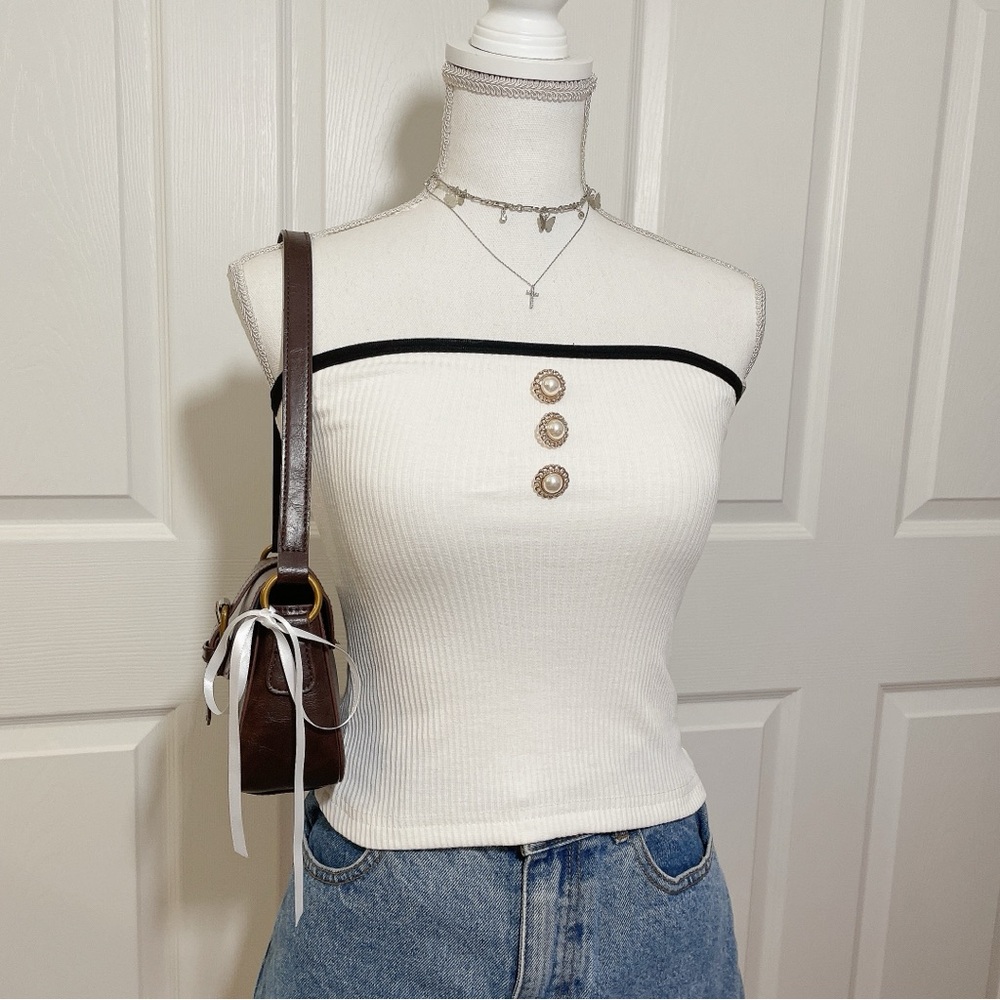 White ribbed crop top with black contrast and pearl buttons